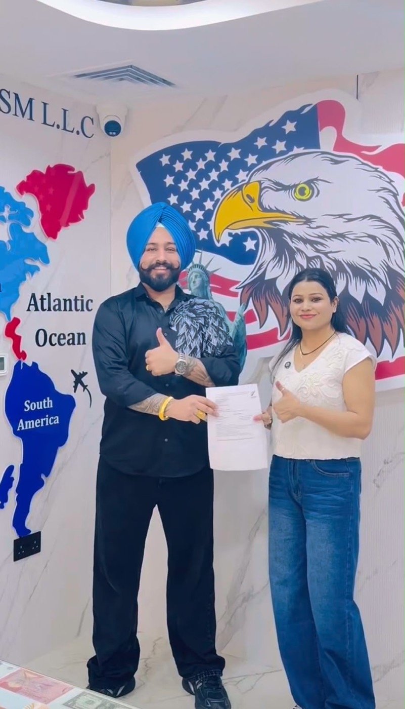 Sukhchain Travel client receiving documents at our office