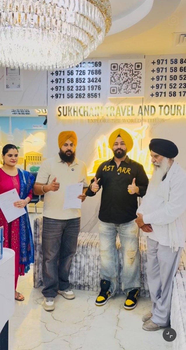 Sukhchain Travel and Tourism with a happy client